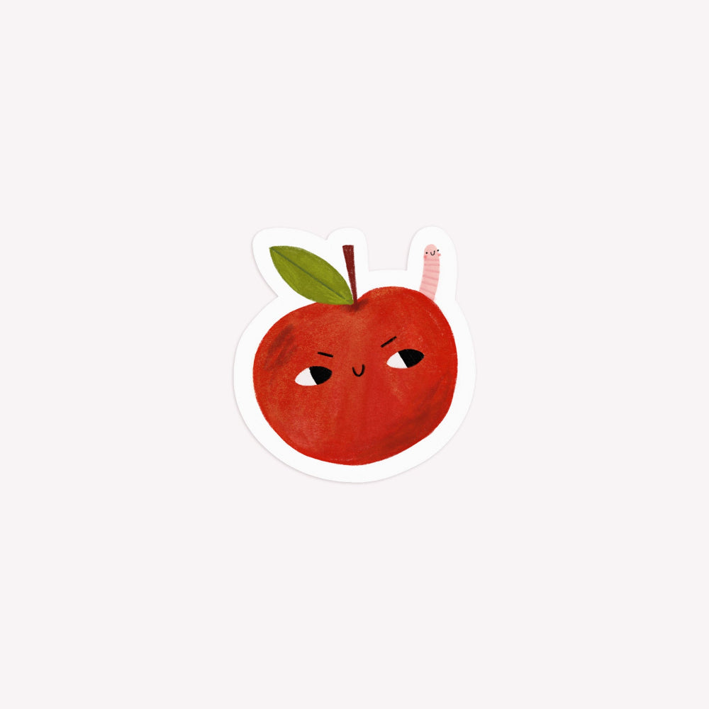 Illustrated, die-cut paper sticker of a red apple and a small pink worm.