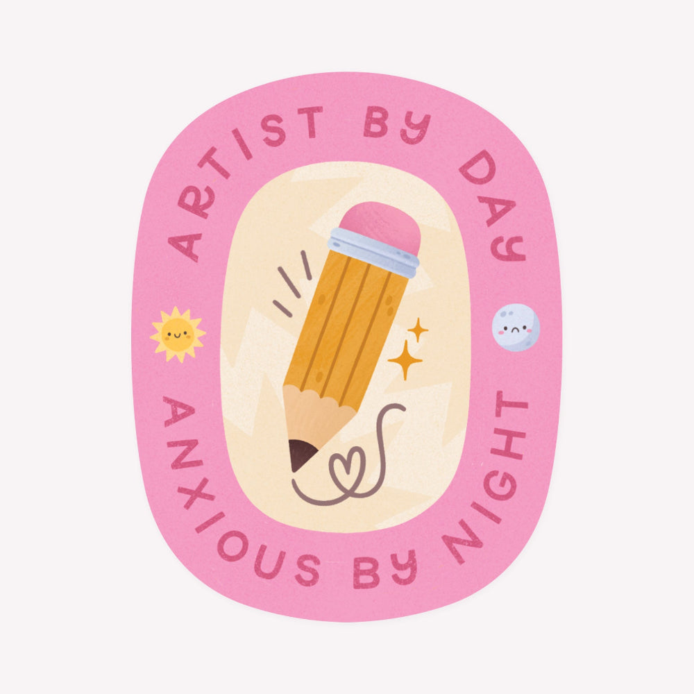 Illustrated pink oval-shaped sticker featuring a chunky yellow pencil bordered by the words "Artist By Day, Anxious By Night".