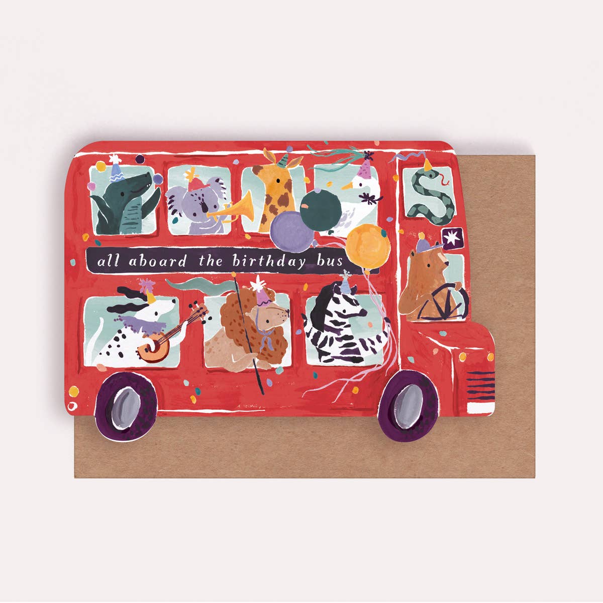 An illustrated greetings card by Sister Paper Co in the shape of a bus with text that reads "All Aboard The Birthday Bus". Various animals fill the bus, dressed in party hats and holding balloons.