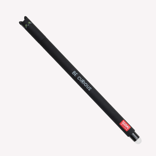 Cat Legami erasable gel pen with a face and pointed cat ears on the lid. The barrel of the pen is black and printed with the text "Be Curious".