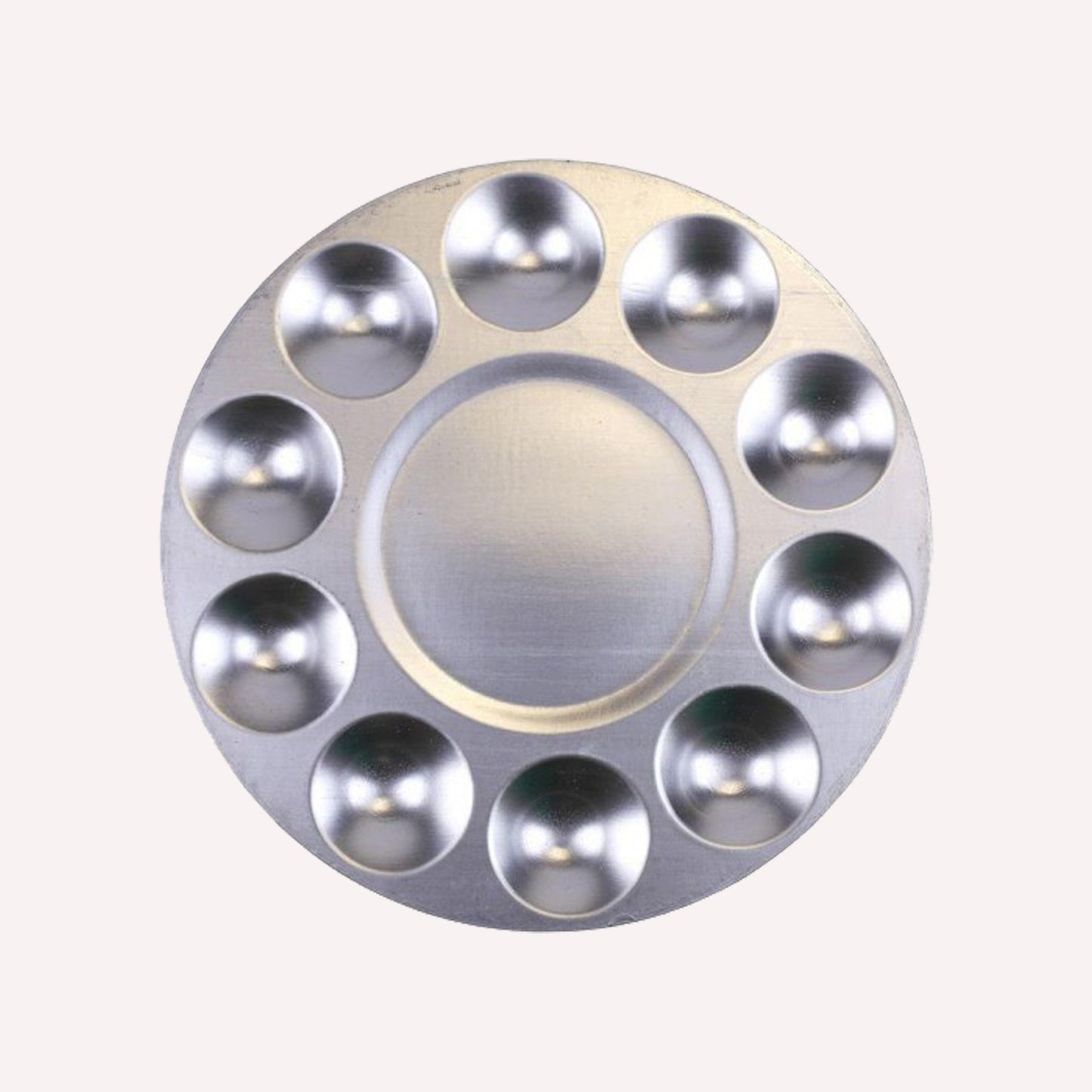 A circular metal 11 well paint palette, with 10 tinting compartments around the edge and a larger well in the centre for mixing paint. Suitable for use with acrylic, gouache and oil paint.