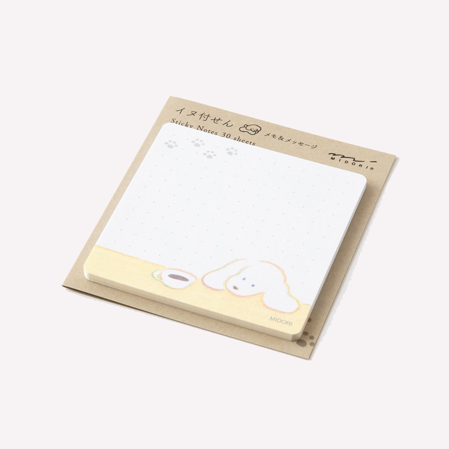 Side view of Midori Dog and Coffee sticky notes. The 30 memo sheets feature a handdrawn dog ang lookng at a cup of coffee on a subtle dot grid background, fitted onto a sturdy card backing.