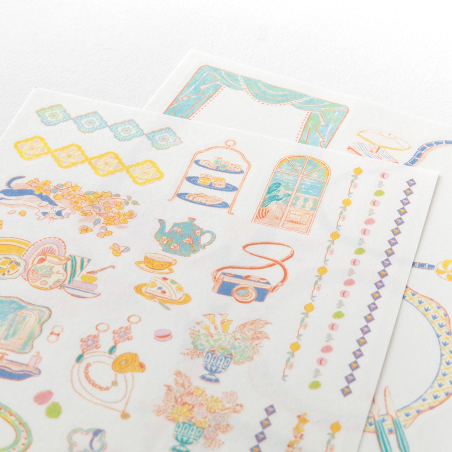 Close up of Midori Travel & Hotel Yuru Log Stickers shows whimsical illustrations printed on a washi paper.
