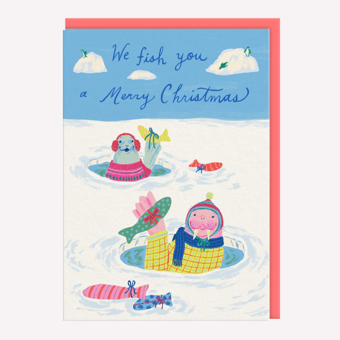 Christmas greetings card featuring illustrated seals in ice with fish shaped gifts. Text reads "we fish you a Merry Christmas."