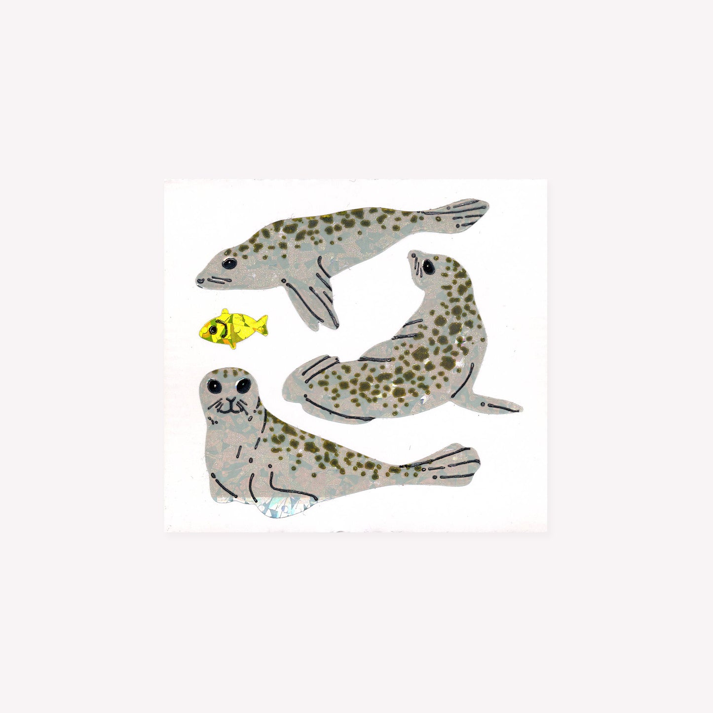 Four prismatic seal and fish stickers on a mini sticker sheet from Stickermagic.