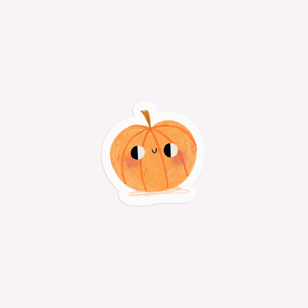 Illustrated, die-cut paper sticker of a orange pumpkin with a smiley face.