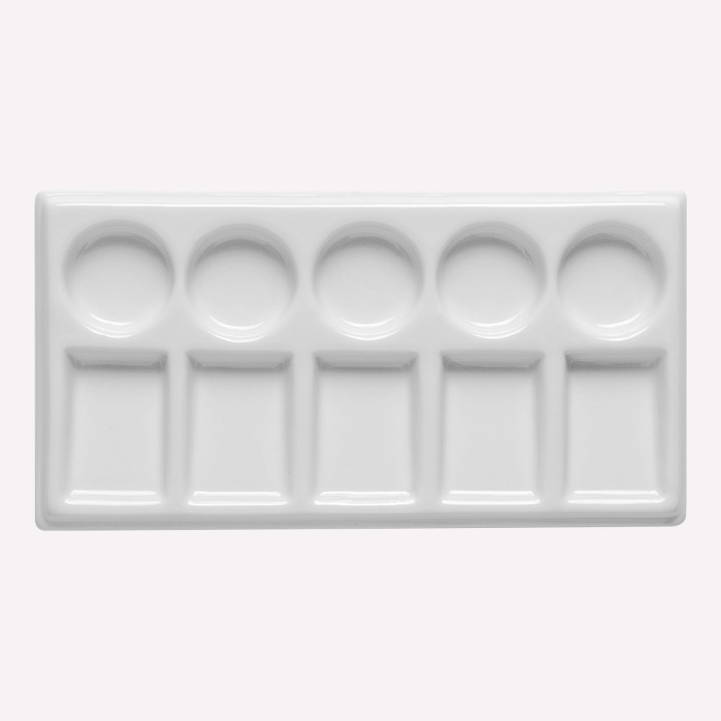 A hardwearing rectangular ceramic 10 well paint palette, with 5 circular and 5 rectangular wells for mixing, storing and diluting paints and inks.