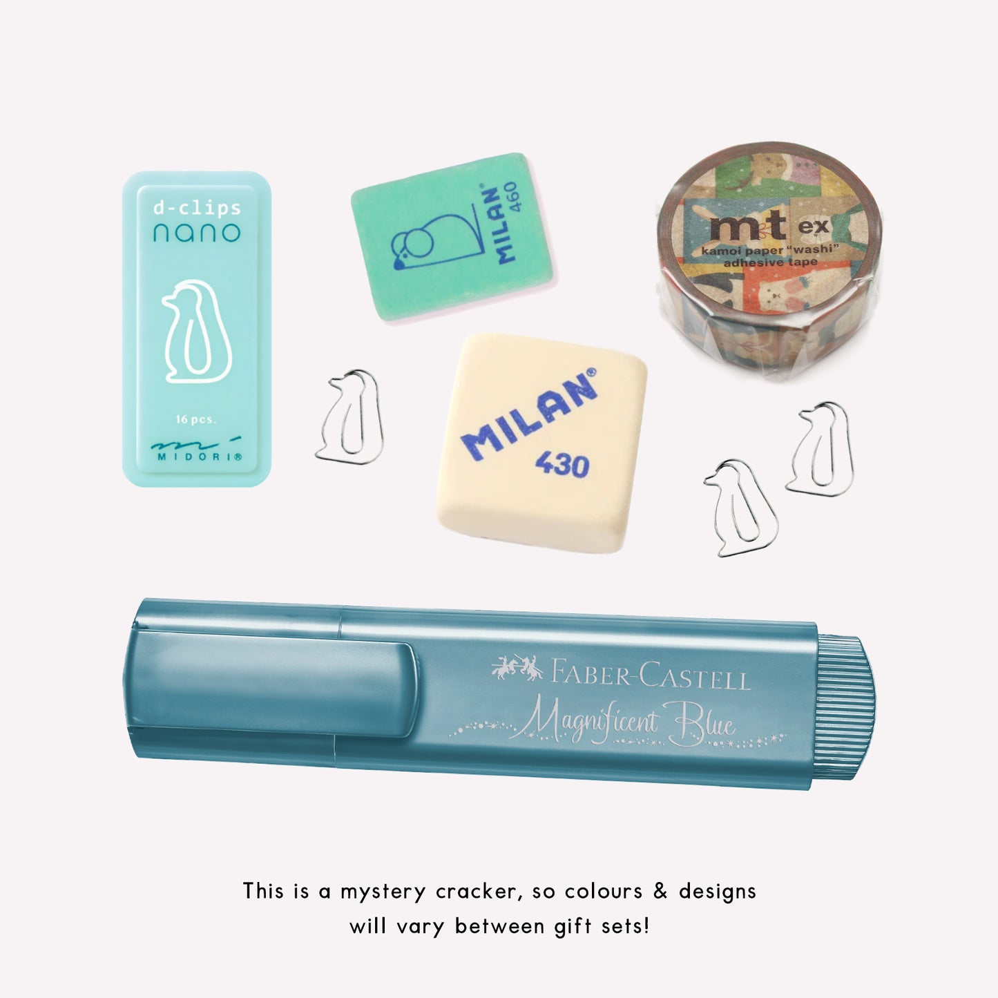 Contents of the Salt Art Supply Christmas Cracker gift including a glittery highlighter, washi tape, mini penguin paperclips and Milan erasers.