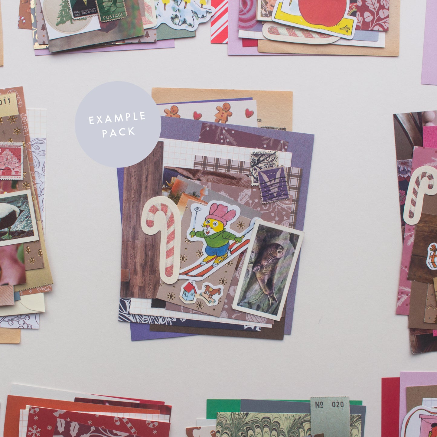 An example journalling & collaging winter edition scrap pack by Salt Art Supply. This purple festive themed pack includes patterned & coloured papers, vintage tea cards and old stamps.