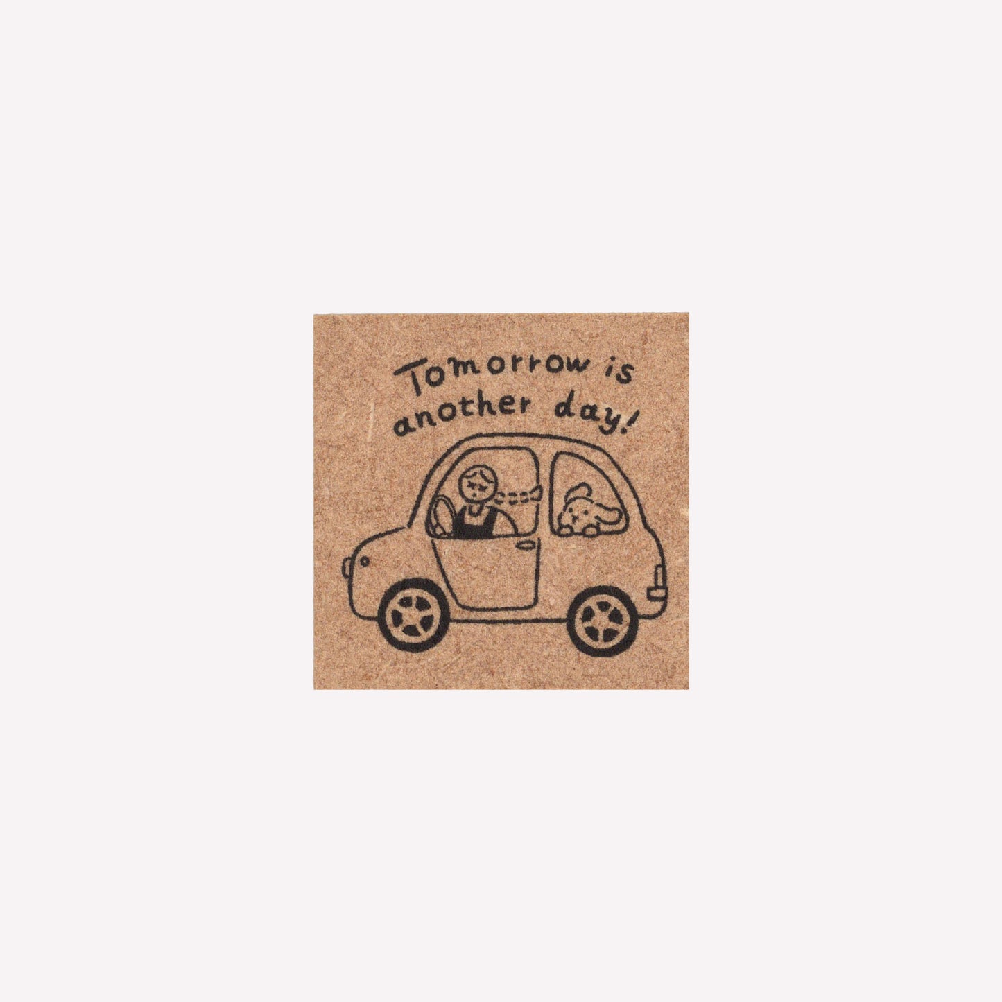 Rubber journalling stamp with a design of a girl and bunny in a car and text reading "tomorrow is another day".