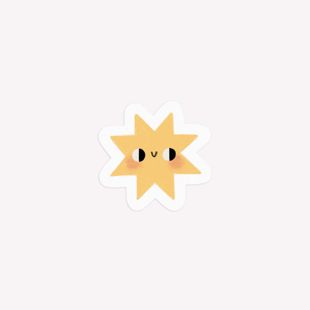 Illustrated, die-cut paper sticker of a yellow star with a smiley face.