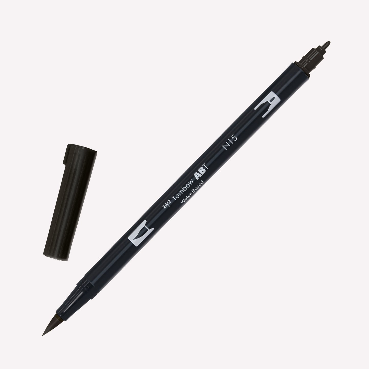 Tombow ABT Dual brush pen in Black (N15) with open caps showing a fine tip for details and a brush tip for expressive marks.