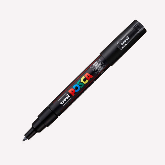 Uni Posca PC-1M paint marker in black with an open lid showing the extra fine 0.7mm nib.