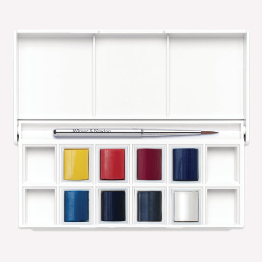 Cotman Watercolour skyscape pocket set, with 8 half pan paints in a curated cool blue palette perfect for painting clouds in the sky or seascapes, presented in a plastic palette packaging with a travel brush.