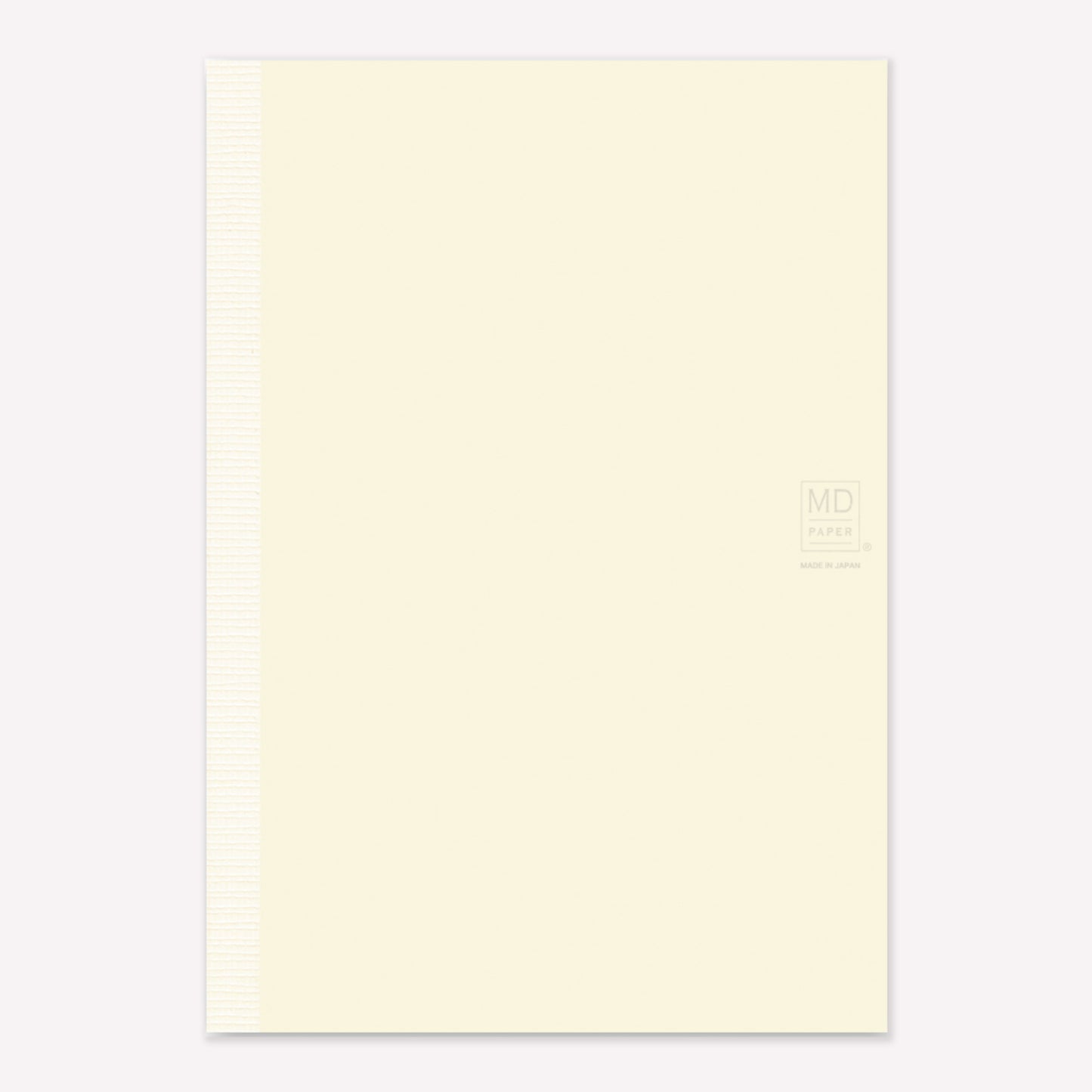 MD Paper A5 Notebook with a minimalist cream cover embossed with the MD logo. 