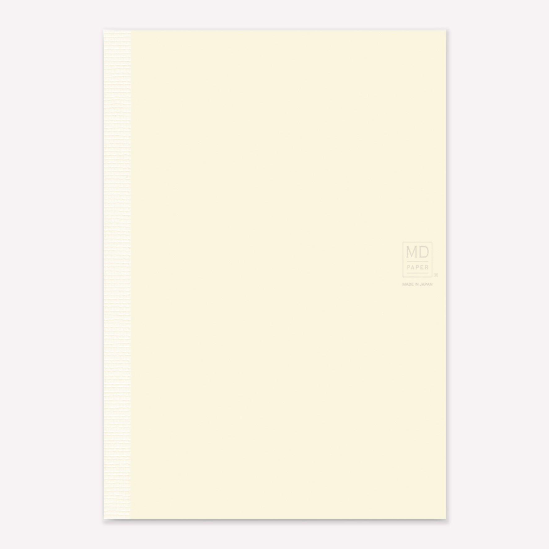 MD Paper A5 Notebook with a minimalist cream cover embossed with the MD logo. 