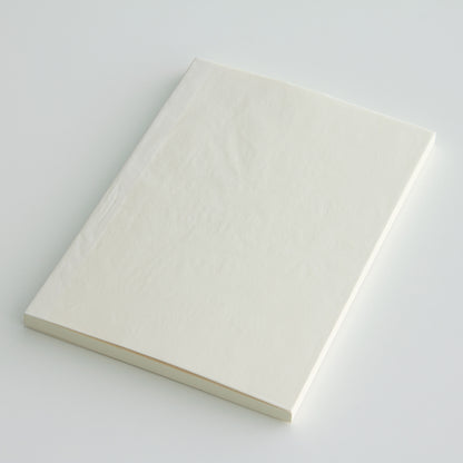 MD paper A7 blank notebook with a protective glassine cover. 