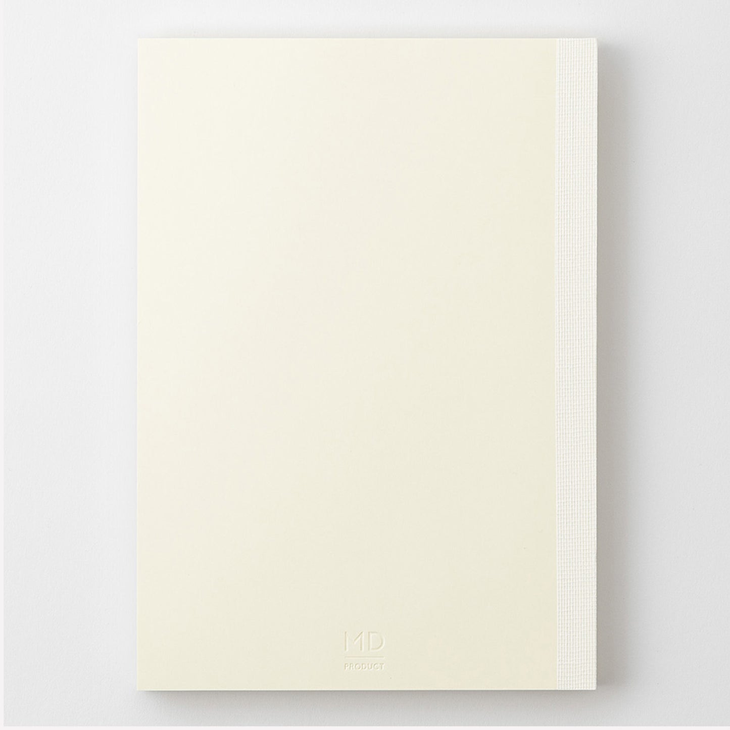 MD Product A5 notebook with a minimal cream cover, thread binding and the MD logo embossed on the back. 