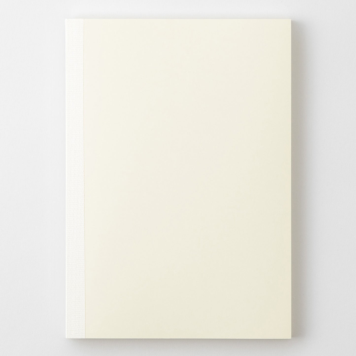 MD Product A5 notebook with a minimal cream cover, thread binding and the MD logo embossed on the back. 