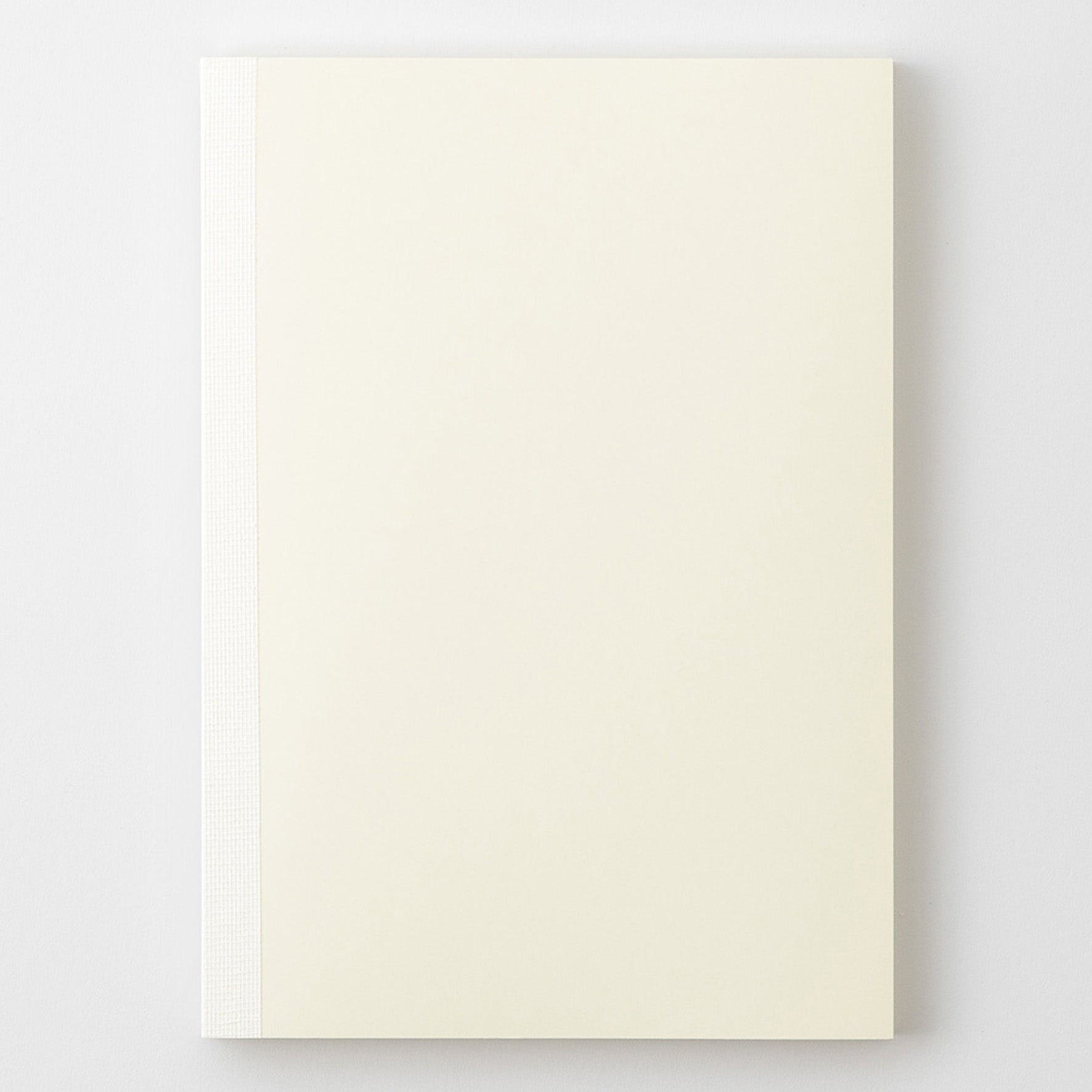 MD Product A5 notebook with a minimal cream cover, thread binding and the MD logo embossed on the back. 