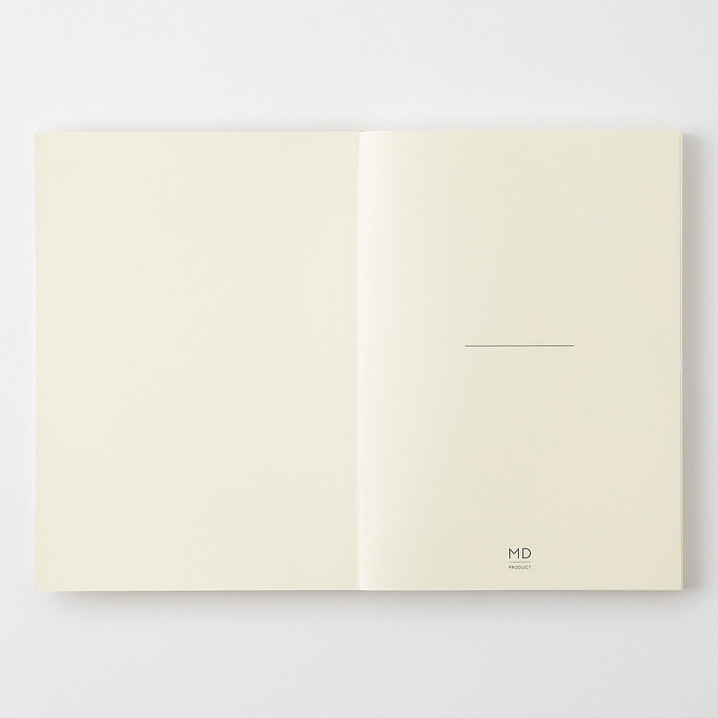 MD Product A5 notebook front pages featuring a minimalist design including room to write your name as well as the MD Product logo. 