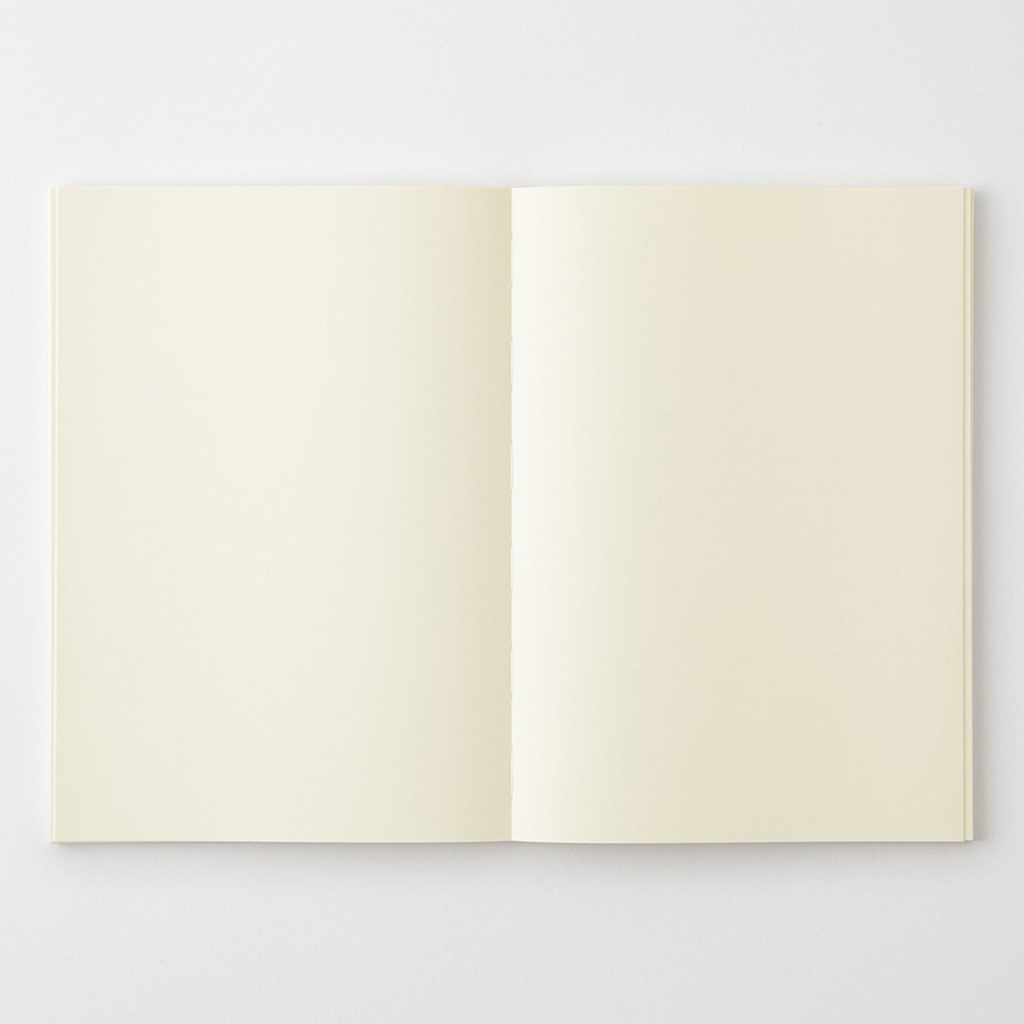 MD Product A5 notebook with blank pages featuring a thread-sewn binding to open flat. 