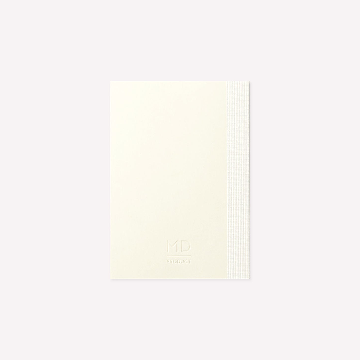MD Product A7 Notebook with a minimalist cream cover and the MD Product logo embossed on the back cover. 