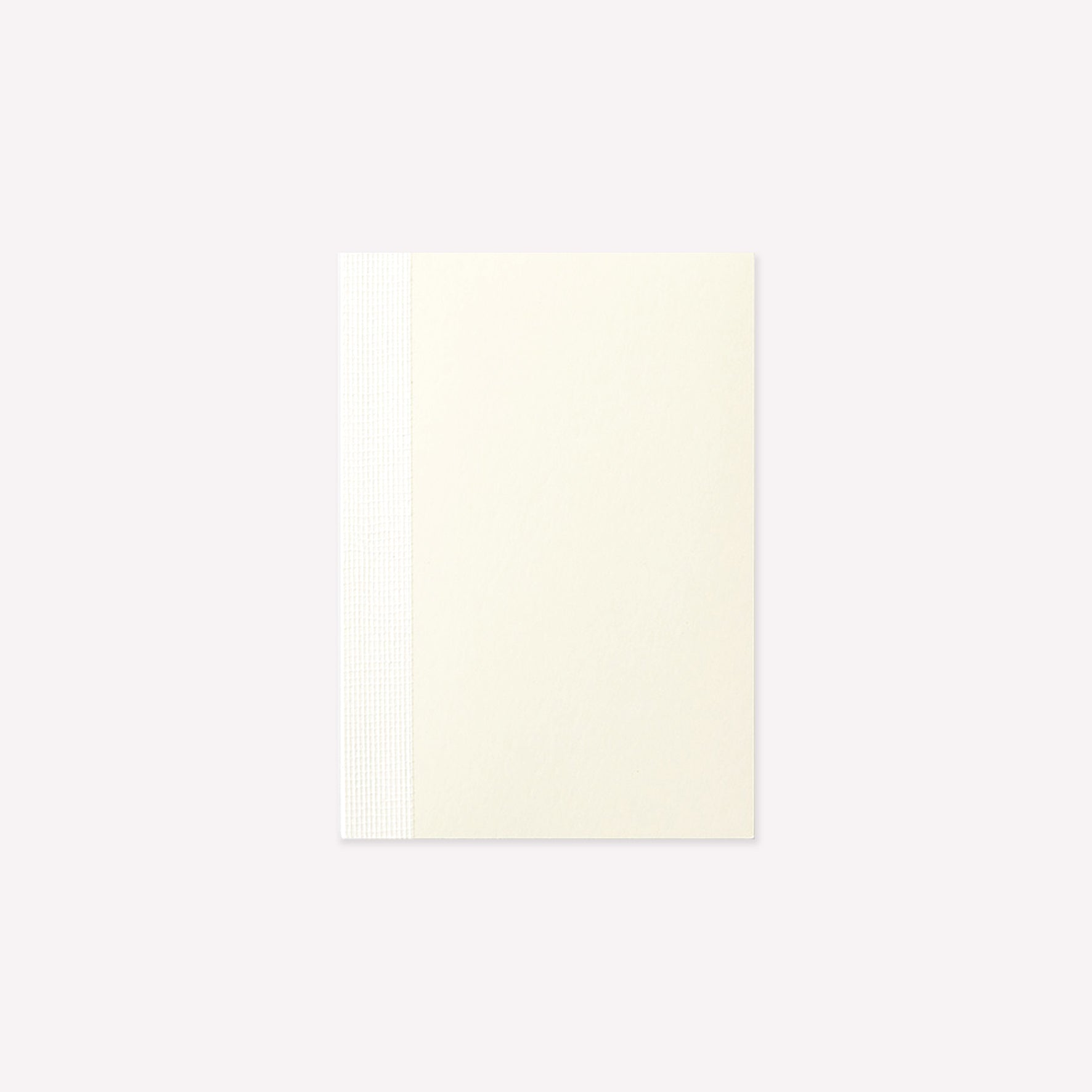 MD Product A7 Notebook with a minimalist cream cover and exposed stitch binding. 