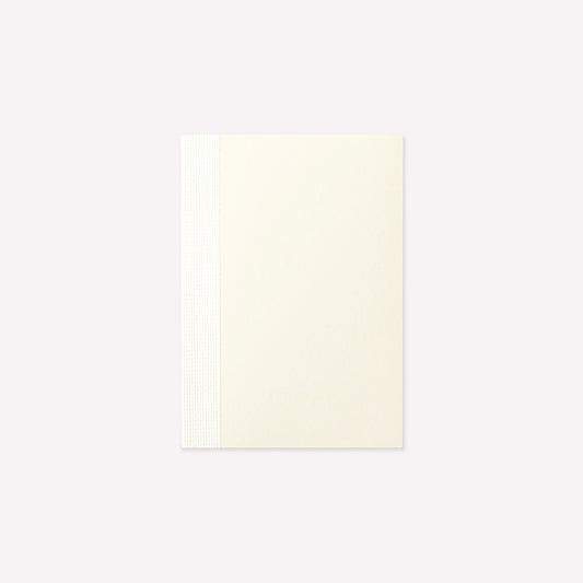 MD Product A7 Notebook with a minimalist cream cover and exposed stitch binding. 