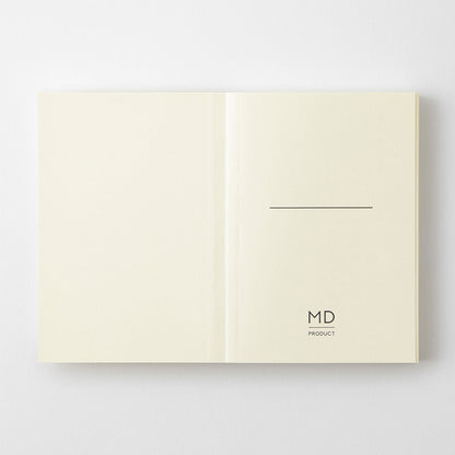 MD Product A7 notebook open on the first page with a minimalist design including space to write your name and the logo. 