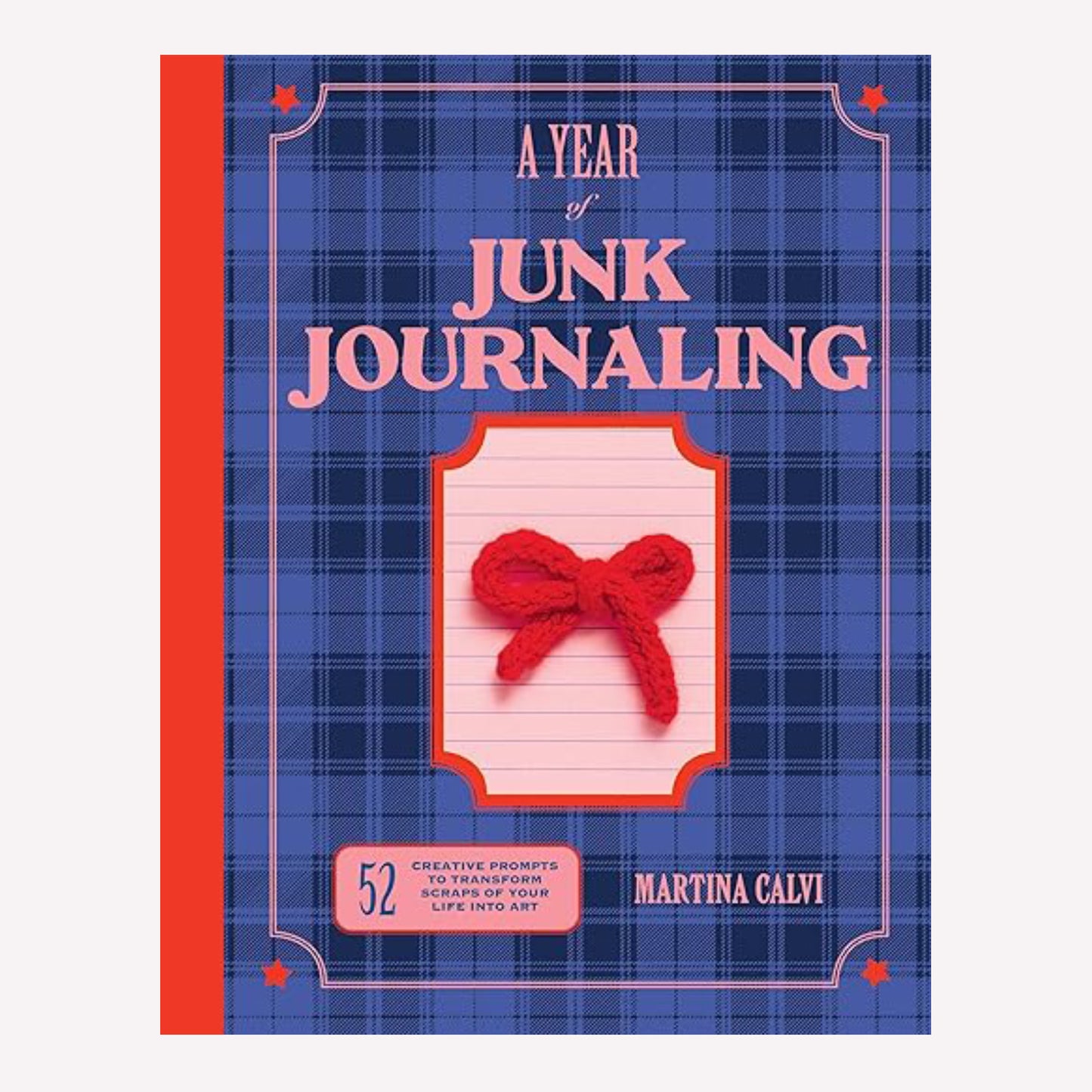 "A Year of Junk Journalling" Book by Martina Calvi with a blue tartan background, pink text, and red bow on the cover. 