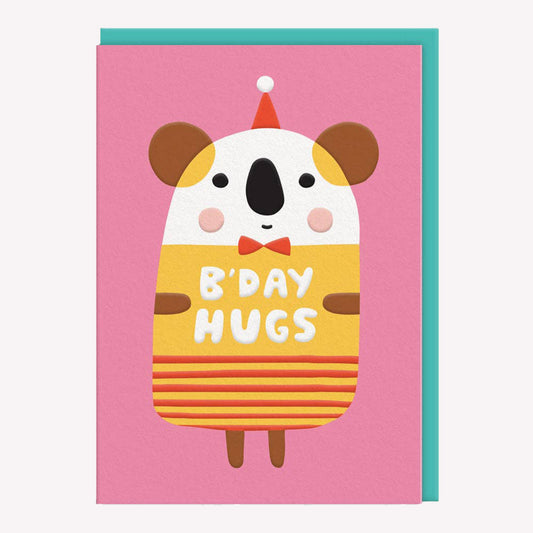 An illustrated birthday card by Suzy Ultman, printed by Ohh Deer. This card features a colourful illustration of a koala in party hat with text that reads “B'day Hugs”.