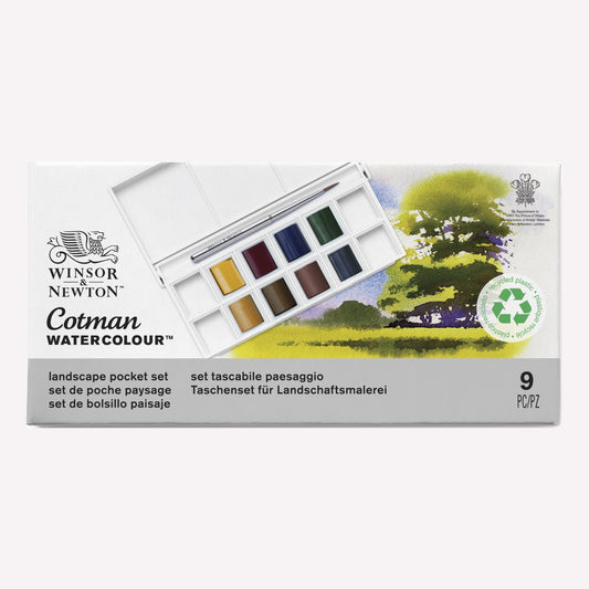 Cotman Watercolour Landscape pocket set, presented in packaging that shows the 8 half pans included, alongside examples of a landscape painting you can create using this set.