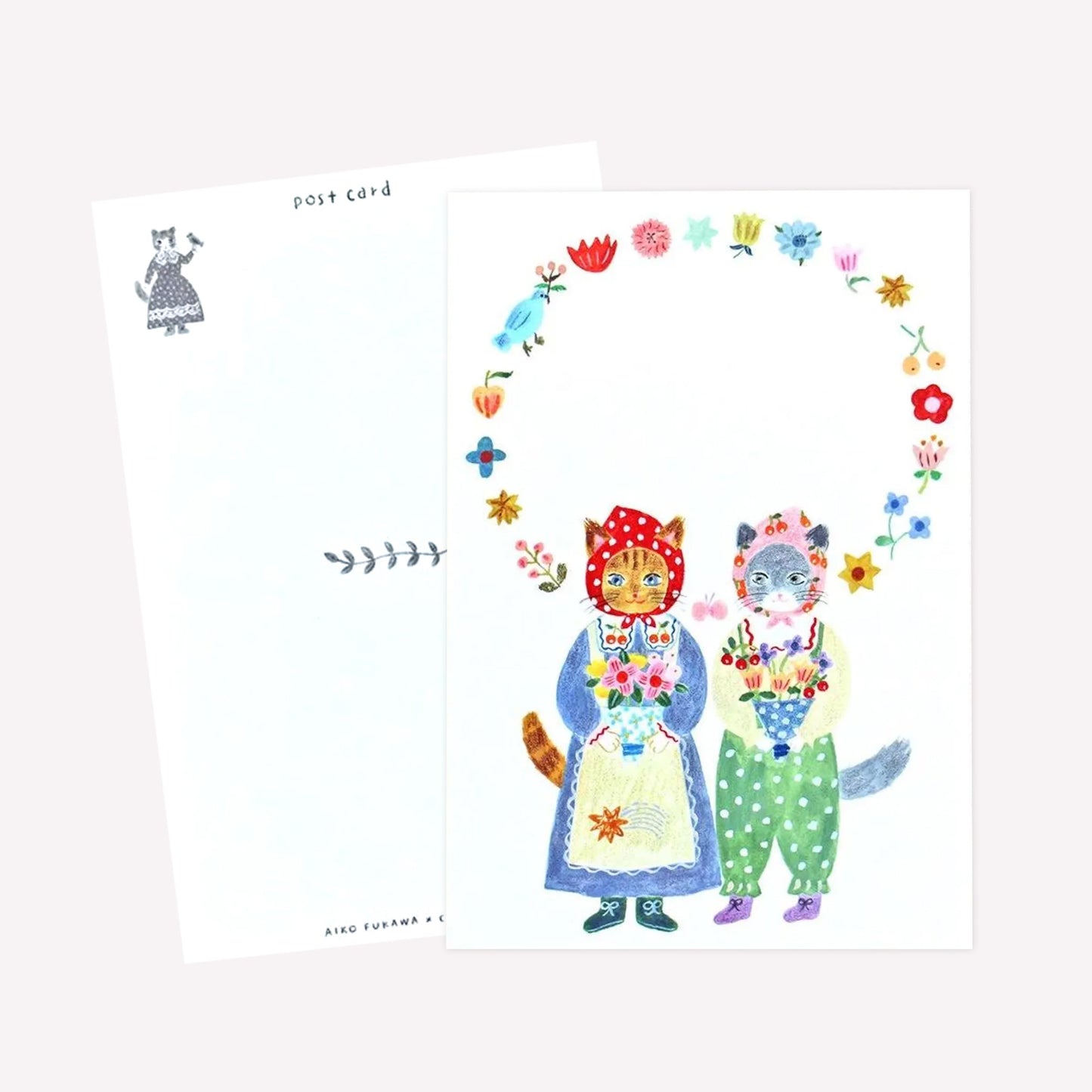 Cozyca Aiko Fukawa postcard design featuring two cats dressed in cute outfits holding bouquets of flowers within a floral border. The revers features a postcard design with space to write a message. 