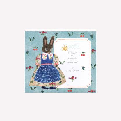 Cozyca Aiko Fukawa flower and amimals memo pad cover featuring a bunny character on a blue background with flowers and cherries. 