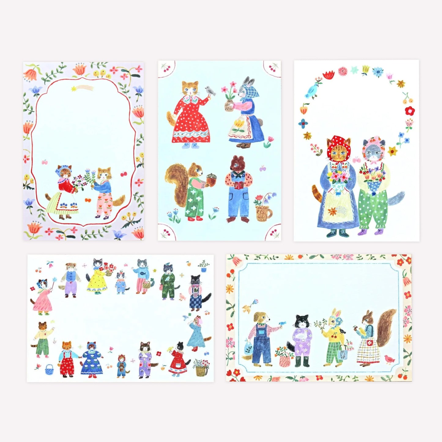 Postcard set by Cozyca Aiko Fukawa with 5 postcard designs featuring various cats , rabbits and squirrels dressed in cute outfits holding bouquets with floral borders. 