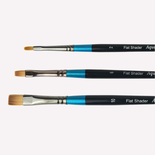 Daler Rowney Aquafine flat shader paintbrush series featuring brushes sized 10, 6, and 2 . Brushes have a classy black handle with blue detailing and a silver ferrule.