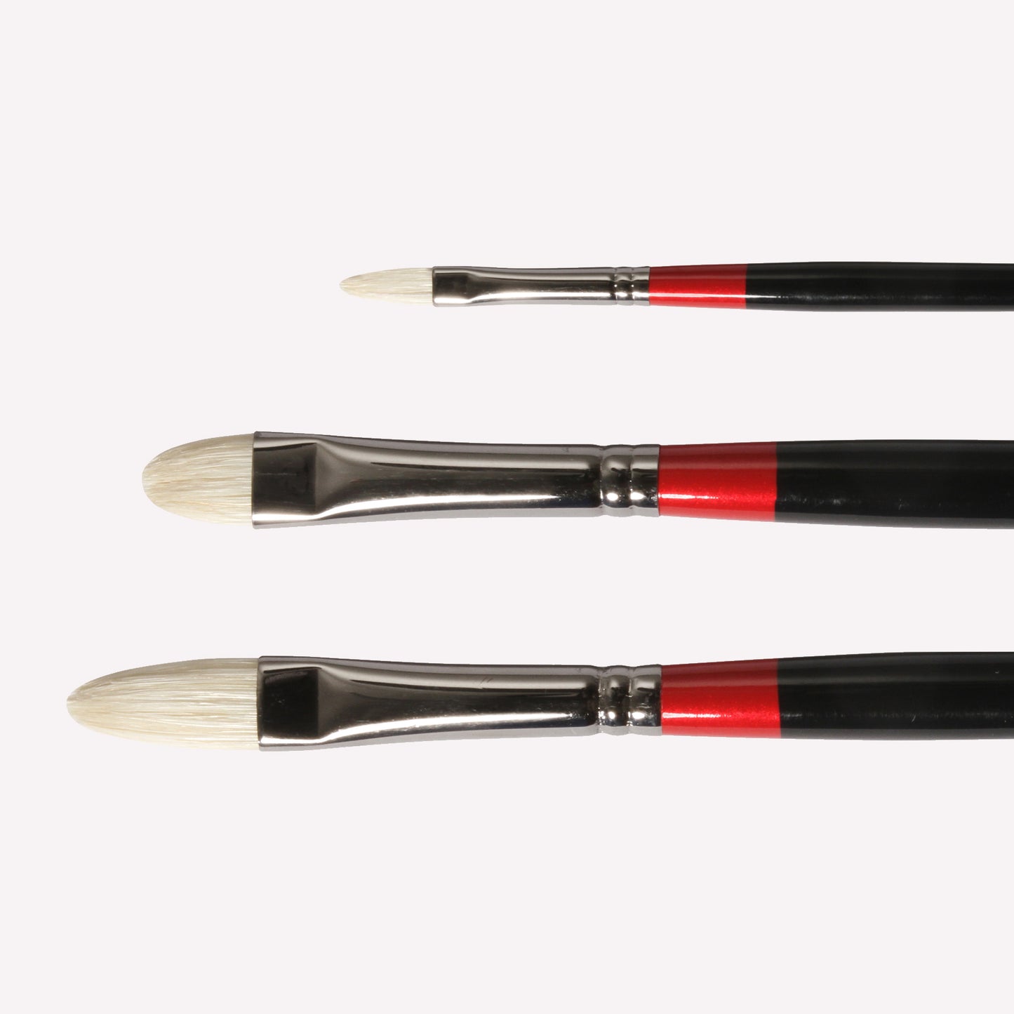 Daler-Rowney Georgian Filbert paintbrushes, available in sizes 2, 6 and short 6 . Brushes have a classy black handle with red detailing and a silver ferrule. 