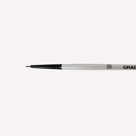 Daler-Rowney graduate synthetic spotter brush in size 10/0. Short, fine bristles are ideal for painting fine lines and details.  Brushes have a white handle and black ferrule. 