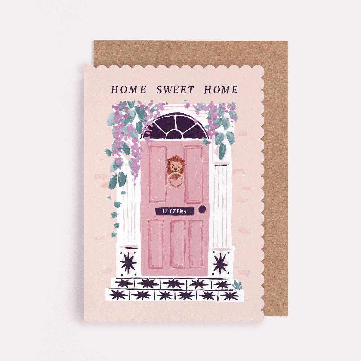 A new home greetings card by Sister Paper Co with a pink front door illustration and text that reads "Home Sweet Home".