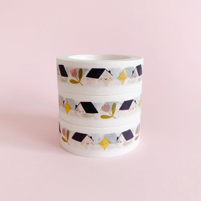 Set of three stacked paper washi tapes, featuring a repeating pattern of houses, tulip flowers and stars.