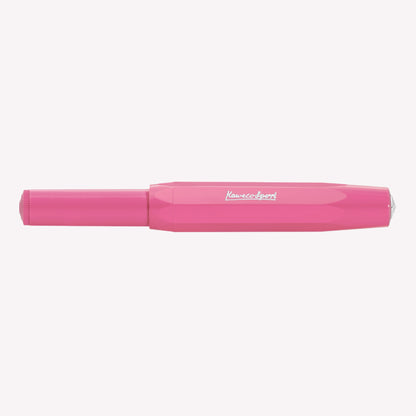 Kaweco Skyline Sport fountain pen with the lid on, featuring a bright pink barrel and silver logo details. 