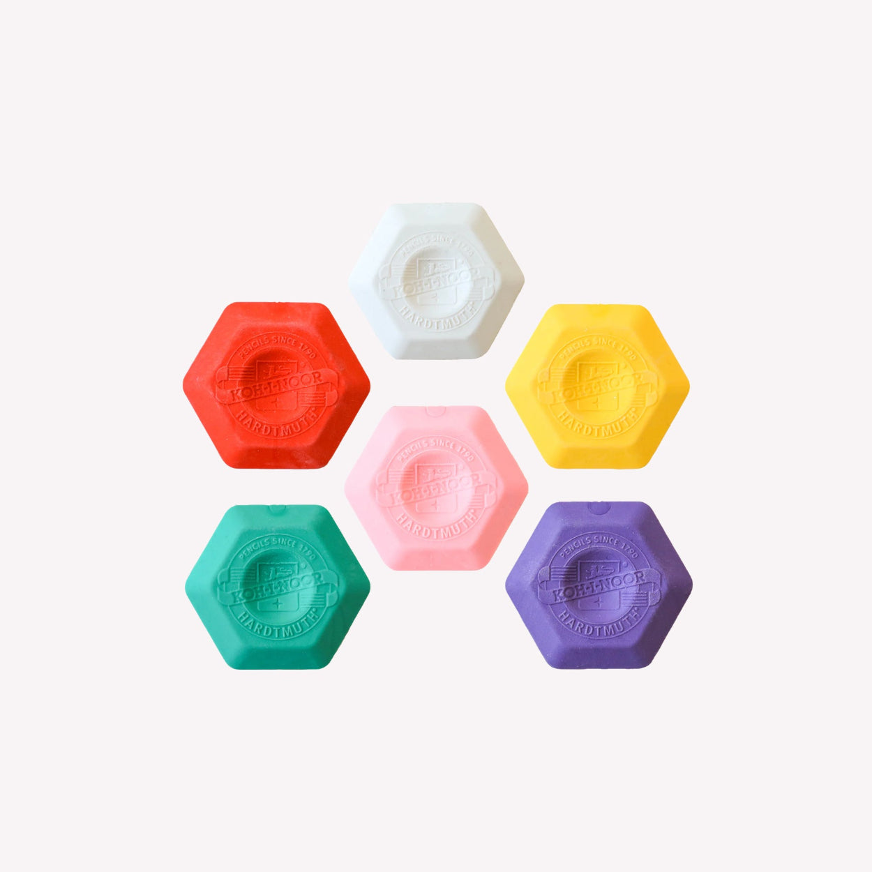Set of six Koh-I-Noor hexagonal shaped thermoplastic erasers in white, red, yellow, pink, green and purple.