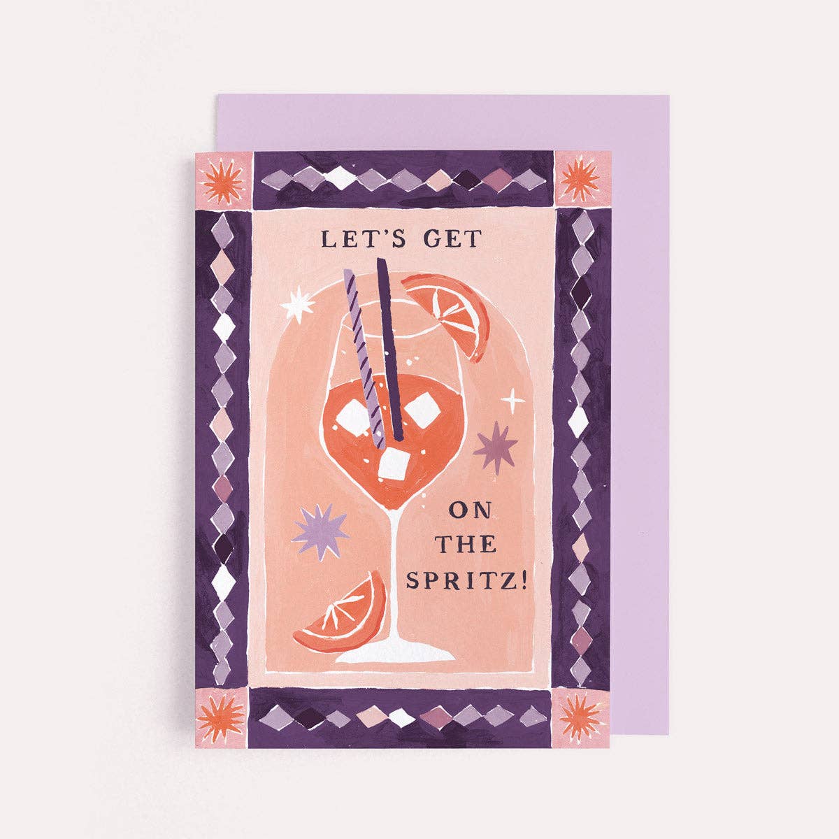 A birthday greetings card by Sister Paper Co with an illustration of an aperol spritz cocktail and text that reads "Let's Get On The Spritz!".