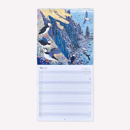 Inside Matt Johnson's ‘Cornwall, Scilly and Lundy Seabirds' Cornwall wall calendar for 2027. The calendar is opened on May, with a full illustration of Puffins in Lundy. 