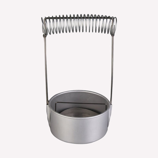 Metal brush washer with a pot to hold cleaning solvent, a mesh to catch paint sediment, and a spring above the pot to hold paintbrushes suspended in the solvent to prevent damage. Pot measures 10cm in diameter and 5cm deep, made from an easy to clean aluminium.. 