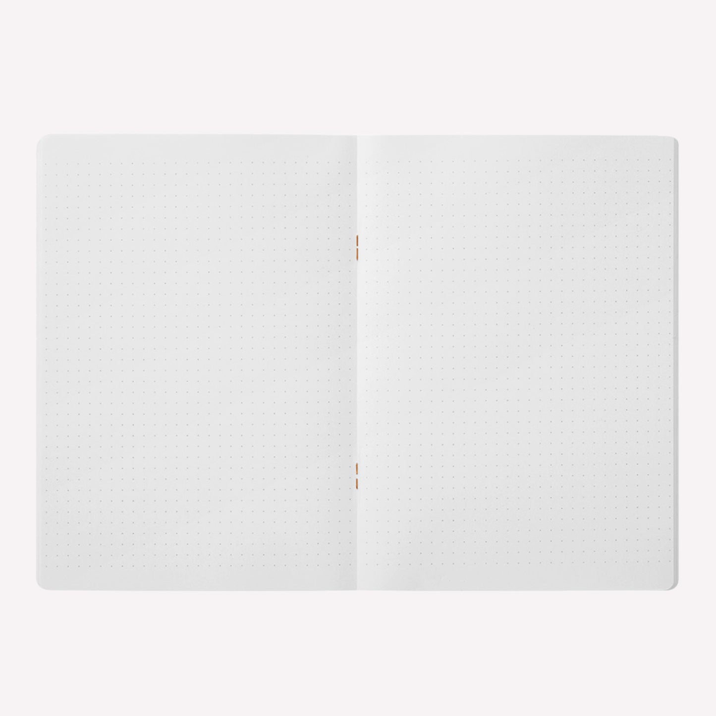 Inside the Midori soft cover stapled notebook. Dot grid pages are white with a 5mm spacing. 