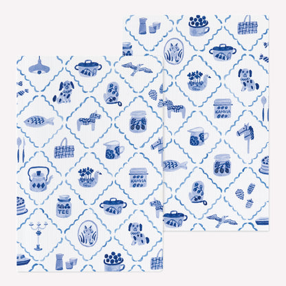 Front and back covers of the Midori Blue Nordic Yuru Log notebook featuring a blue and white brush pen style pattern of scandinavian motifs. 