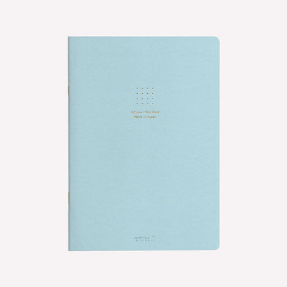Front cover of the Midori blue soft cover sketchbook with gold foil text in the centre reading "A5 size/Dot Grid. Made in Japan". 