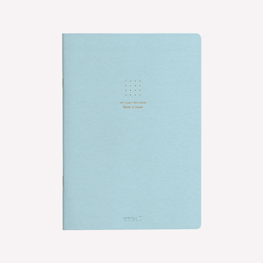 Front cover of the Midori blue soft cover sketchbook with gold foil text in the centre reading "A5 size/Dot Grid. Made in Japan". 